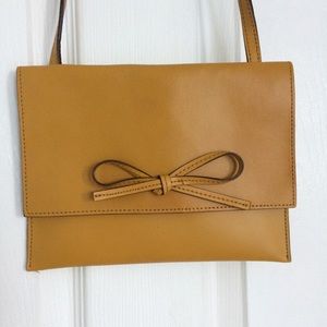 Mustard colored new without tags purse